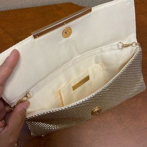 Metallic Gold clutch with chain strap.